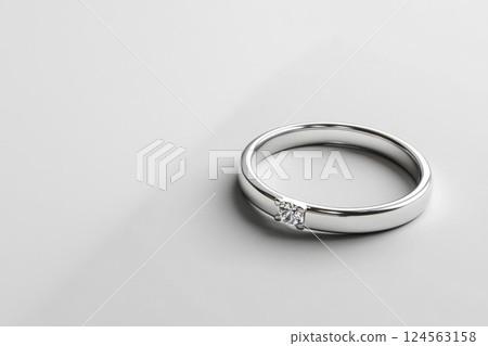 Elegant silver ring with subtle design on pristine white background 124563158