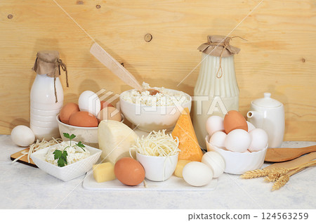 Assorted fresh dairy products, healthy breakfast with ingredients, natural nutrition concept, maintaining healthy intestinal microflora, diet food, rustic table, selective approach 124563259