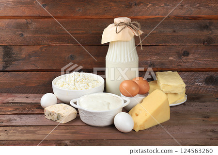 Assortment of fresh dairy products, healthy breakfast with ingredients, natural nutrition concept, maintaining healthy intestinal microflora, diet food, rustic table, selective focus 124563260