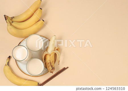 Healthy eating concept, Banana vegan alternative milk lactose and gluten free, no allergies, maintaining healthy gut microflora, diet food, weight loss, selective focus Healthy eating concept, Banana vegan alternative milk lactose and gluten free, no allergies, maintaining healthy gut microflora, diet food, weight loss, selective focus 124563310