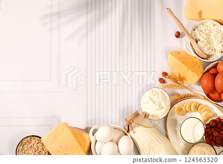 Milk, cottage cheese, cheese, eggs and sour cream on the kitchen table, Assortment of fresh dairy products, the concept of natural nutrition, maintaining healthy intestinal microflora, dietary Milk, cottage cheese, cheese, eggs and sour cream on the kitchen table, Assortment of fresh dairy products, the concept of natural nutrition, maintaining healthy intestinal microflora, dietary 124563320