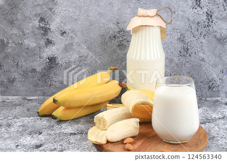 Banana vegan alternative milk lactose and gluten free, no allergies, healthy eating concept, maintaining healthy gut microflora, diet food, weight loss, selective focus Banana vegan alternative milk lactose and gluten free, no allergies, healthy eating concept, maintaining healthy gut microflora, diet food, weight loss, selective focus 124563340
