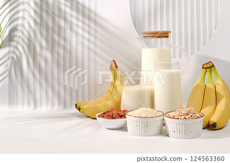 Vegan non-dairy range. Banana, oat, rice and almond vegan alternative milk lactose and gluten free, allergy free, healthy diet concept weight loss, selective focus 124563360
