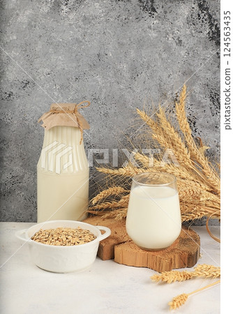 Oat vegan alternative milk lactose and gluten free, allergy free, healthy eating concept, maintaining healthy gut microflora, diet nutrition, weight loss, selective focus Oat vegan alternative milk lactose and gluten free, allergy free, healthy eating concept, maintaining healthy gut microflora, diet nutrition, weight loss, selective focus 124563435