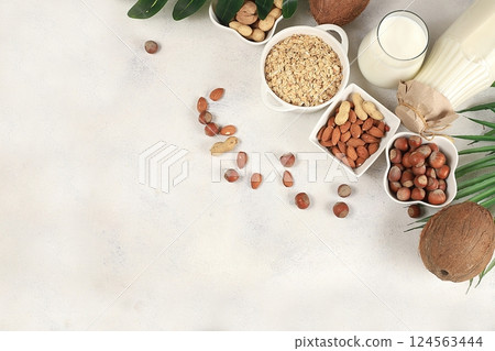 Assorted vegan lactose free milk, coconut, nut, oat, almond, milk replacer, healthy breakfast with ingredients, natural nutrition concept, maintaining a healthy intestinal microflora, diet food, Assorted vegan lactose free milk, coconut, nut, oat, almond, milk replacer, healthy breakfast with ingredients, natural nutrition concept, maintaining a healthy intestinal microflora, diet food, 124563444