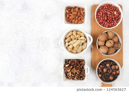 Assortment of various nuts, the concept of healthy natural nutrition, almonds, pecans, pistachios, cashews, walnuts and pine nuts, high-calorie food with vegetable protein and vitamins, the basis of Assortment of various nuts, the concept of healthy natural nutrition, almonds, pecans, pistachios, cashews, walnuts and pine nuts, high-calorie food with vegetable protein and vitamins, the basis of 124563627