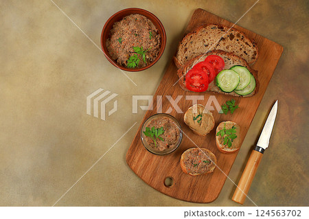 Homemade sandwiches with chicken pate, tomatoes, herbs and cucumbers, the concept of a healthy lifestyle and natural nutrition. Healthy breakfast with ingredients, advertising for a cafe, selective 124563702
