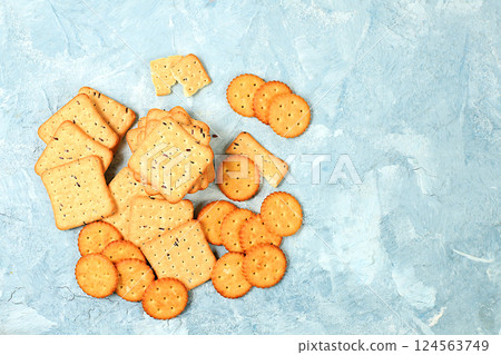Homemade gluten free chocolate chip and nut cookies on a concrete background, modern bakery concept with dry french sesame cracker. Healthy breakfast with ingredients, top view, selective focus, 124563749