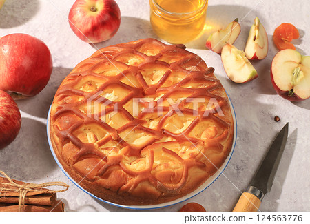 Apple pie with honey,apples, spices, modern bakery concept, advertisement for menu and recipe, banner, selective focus, top view, space for text, 124563776