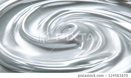 Swirling silver liquid on a smooth surface creating an abstract pattern 124563870