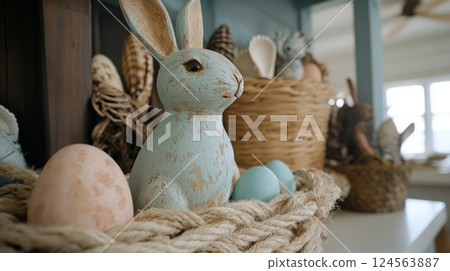 Coastal style Easter decor features a charming Easter bunny surrounded by seashells and beach house accents for a delightful spring celebration 124563887