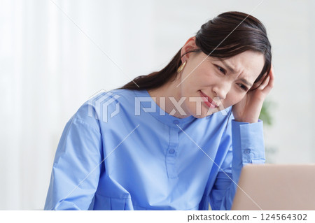 A businessman woman thinking using a computer 124564302