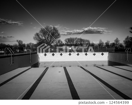 inside an empty and drained winterized swimming pool  124564399