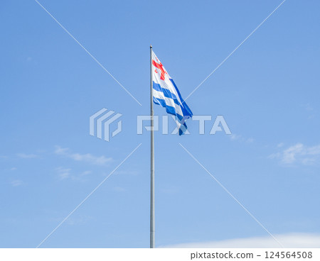 Adjara flag against the sky. Flag of the region in Georgia. State symbols. 124564508