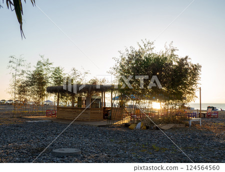 Cafe by the sea. Stylized catering establishment. Restaurant in the subtropics. 124564560