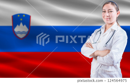 Female Doctor on Slovenian Flag. Doctor with Crossed Arms on Slovenian Flag. Slovenia Health and Care Concept 124564975
