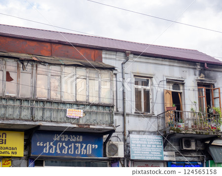 Old Asian building facade. Tourism in the old city. Advertisement and old house. Asia old city architecture Old Asian building facade. Tourism in the old city. Advertisement and old house. Asia old city architecture 124565158