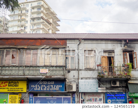 Old Asian building facade. Tourism in the old city. Advertisement and old house. Asia old city architecture Old Asian building facade. Tourism in the old city. Advertisement and old house. Asia old city architecture 124565159