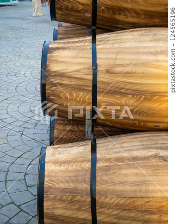 Wooden barrels. Vessels for wine. Liquid storage tank Wooden barrels. Vessels for wine. Liquid storage tank 124565196