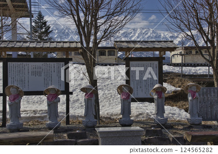 Six Jizo statues at Hakuba Station and the Hakuba Sanzan mountains. Beautiful spring scenery of Hakuba. Hakuba Village, Nagano Prefecture. Six Jizo statues at Hakuba Station and the Hakuba Sanzan mountains. Beautiful spring scenery of Hakuba. Hakuba Village, Nagano Prefecture. 124565282