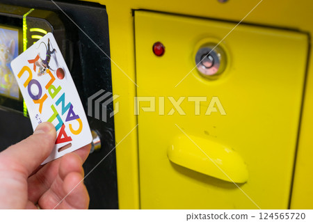Sioux Falls, South Dakota, USA - 12.10.2023: All you can play card used for games at Chuck E. Cheese 124565720