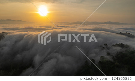 Aerial view of An early morning sunrise over Misty Mountain Valley Aerial view of An early morning sunrise over Misty Mountain Valley 124565855