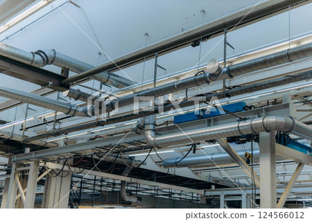 Overhead crane or bridge crane consists of parallel runways with a bridge between column also include hoist lifting and rope. Machinery for manufacturing or transportation in factory or warehouse. Overhead crane or bridge crane consists of parallel runways with a bridge between column also include hoist lifting and rope. Machinery for manufacturing or transportation in factory or warehouse. 124566012