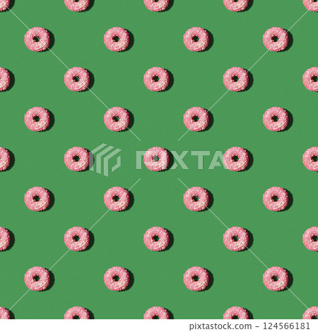 Seamless pattern with pink donuts on the green background. Concept of the New Year, Christmas, Celebration. Food background Seamless pattern with pink donuts on the green background. Concept of the New Year, Christmas, Celebration. Food background 124566181