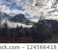 Misty Mountain Landscape with Cabin  124566418