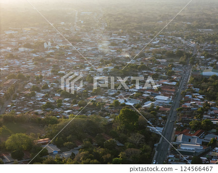 Sunset view over Jinotepe town with scattered houses and winding streets 124566467