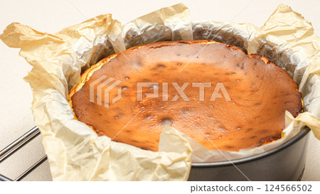 Stunning Top View of a Delicious Homemade Baked Cheesecake with Cracks on White Background 124566502