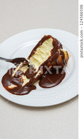 Delicious and Indulgent Cheesecake with Rich Chocolate Fudge Sauce Topping for Dessert Lovers Delicious and Indulgent Cheesecake with Rich Chocolate Fudge Sauce Topping for Dessert Lovers 124566506