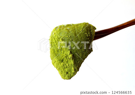 Melty matcha warabi mochi lifted with a wooden spoon Melty matcha warabi mochi lifted with a wooden spoon 124566635