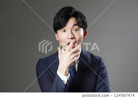 Surprised businessman black background 124567474
