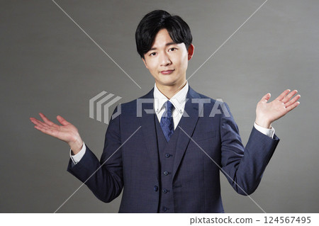 Businessman giving up black background 124567495