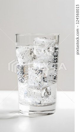 Refreshing Glass of Sparkling Water with Ice Cubes 124568015