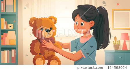 A little girl is happily playing with a stuffed toy teddy bear in her room 124568024