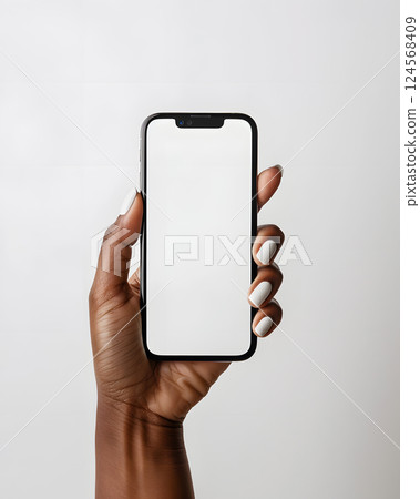Hand holding a cell phone with a white screen, displaying a rectangle 124568409