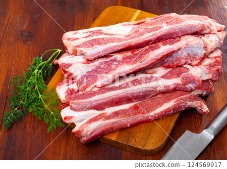 Raw beef steak with dill served to table Raw beef steak with dill served to table 124569917