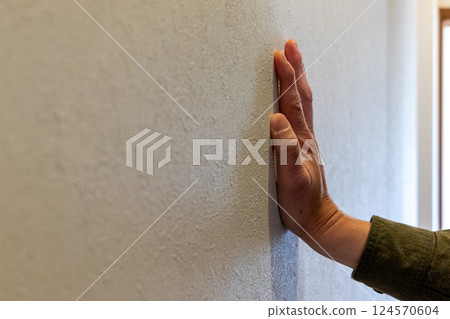 Place one hand on the wall Place one hand on the wall 124570604