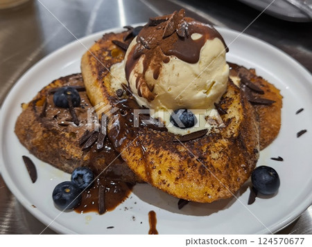 Delicious French Toast with Ice Cream and Chocolate Sauce Delicious French Toast with Ice Cream and Chocolate Sauce 124570677