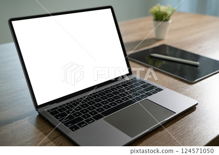 Laptop with blank screen on table. Workspace background new project on laptop computer with blank copy space screen for your advertising text message Laptop with blank screen on table. Workspace background new project on laptop computer with blank copy space screen for your advertising text message 124571050