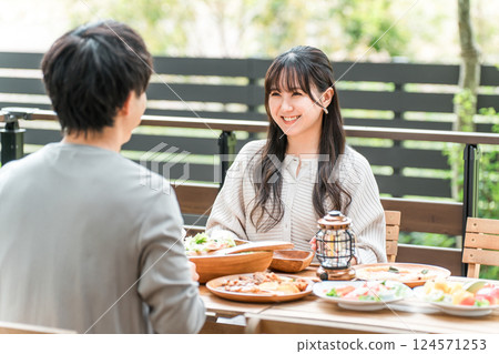 Couples and married couples dining on a wooden deck, terrace, or balcony (glamping/verandaping) Couples and married couples dining on a wooden deck, terrace, or balcony (glamping/verandaping) 124571253