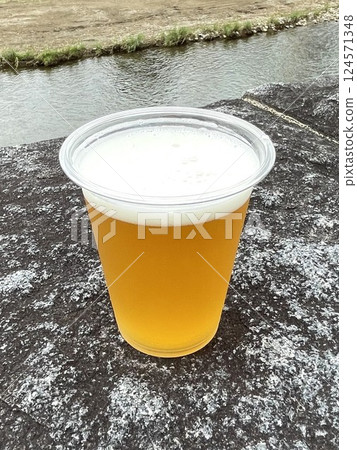 Beer poured over the river Beer poured over the river 124571348