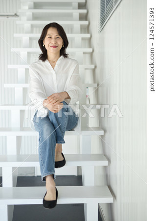 Middle-aged woman's beauty wearing denim Middle-aged woman's beauty wearing denim 124571393