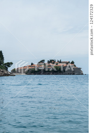 Sveti Stefan private island in Montenegro near Budva. Adriatic Sea Coast travel destination vacation holiday idea. Concept of getting away tourism experiences. Nature driven scenery 124572329