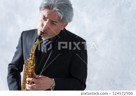 Male saxophone player Male saxophone player 124572500