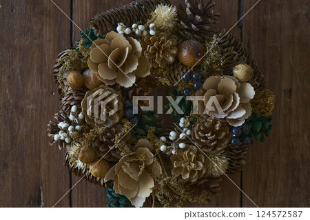 Christmas wreath on an antique wooden wall Christmas wreath on an antique wooden wall 124572587