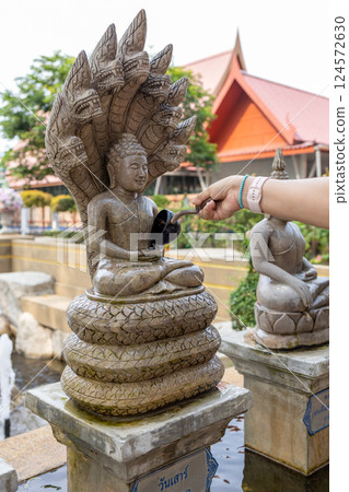 People Pouring water on Buddha to The Statue of buddha in Wat Hong Rattanaram People Pouring water on Buddha to The Statue of buddha in Wat Hong Rattanaram 124572630
