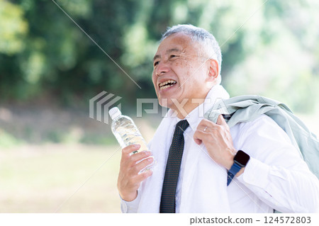 A man going out in the heat A man going out in the heat 124572803